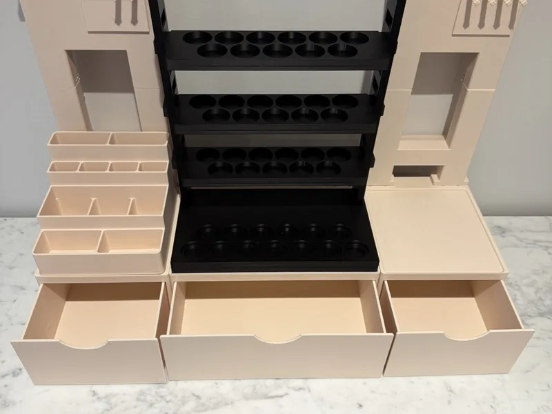 Beige and black 3D printed hobby workstation with drawers, shelves and a paint rack