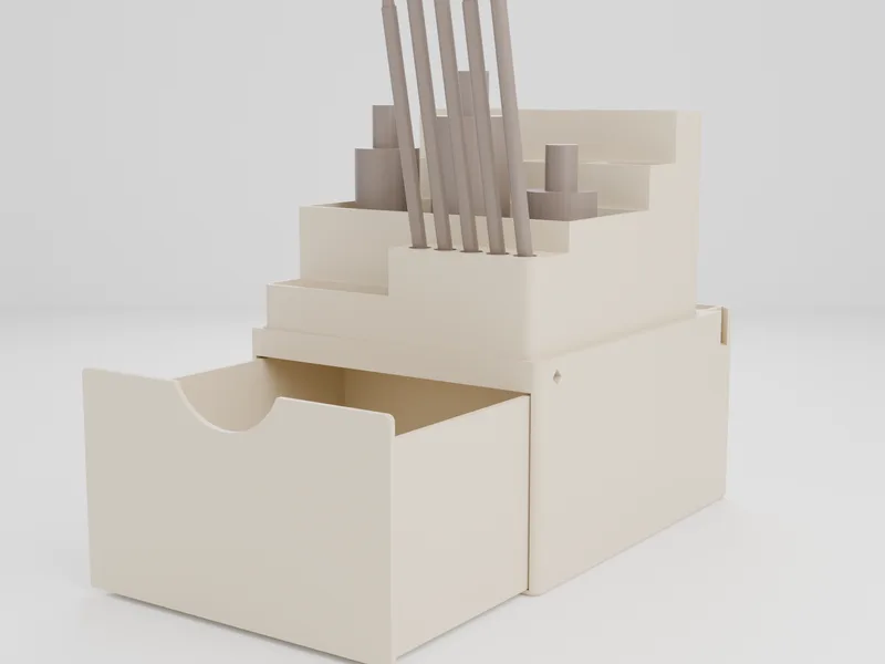 Close-up of one section with its drawer out and the bin module on top: brushes leaning forward in a front row, a low open tray beside them, upright bottle bays, tool slots and deep bins behind