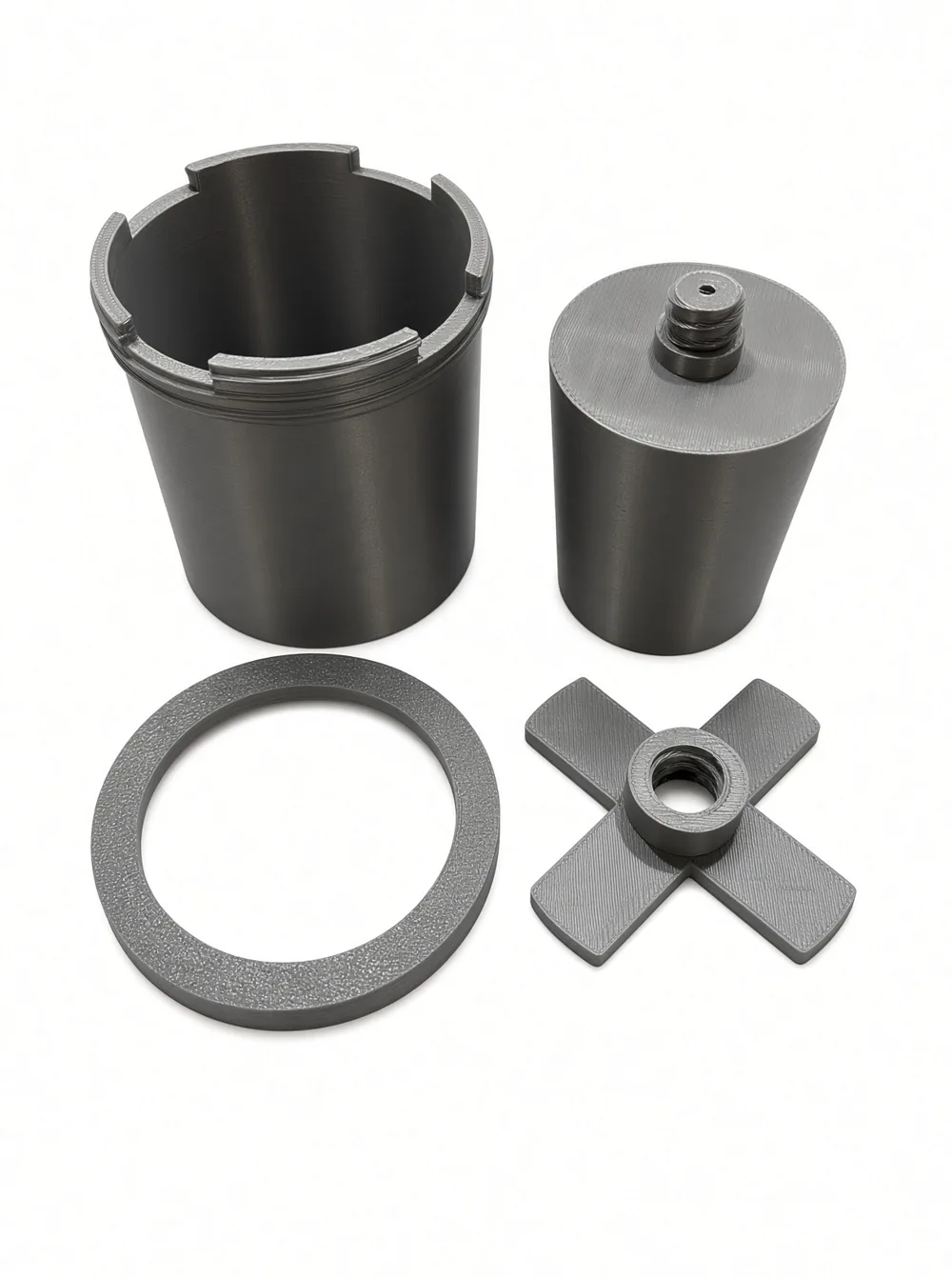The four printed parts of the Mould Maker silicone mould jig: cup, master, locking ring and centring cross