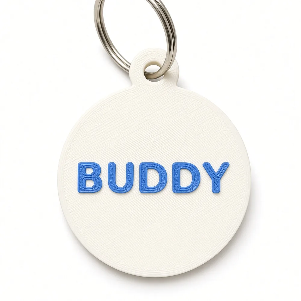 BUDDY pet ID tag: name raised in Cobalt Blue on a Jade White round tag with split ring