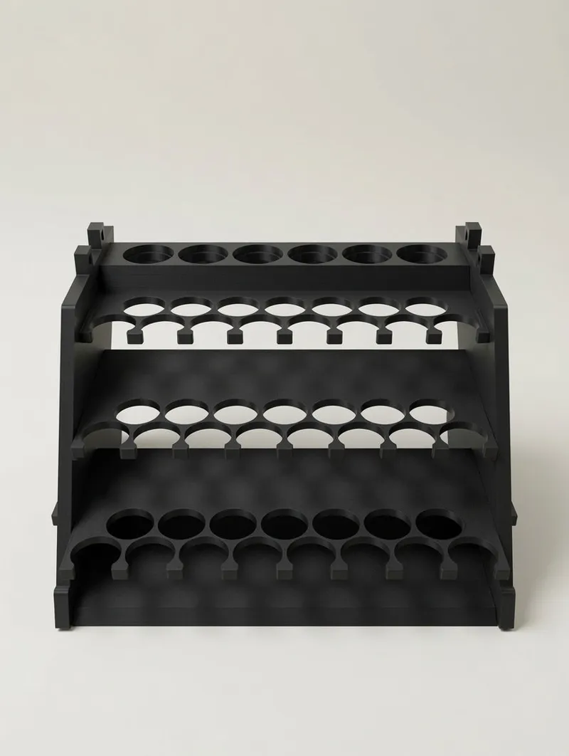 Flat-pack parts of the Paint Rack Tower laid out: plates, wings, wedges and pins