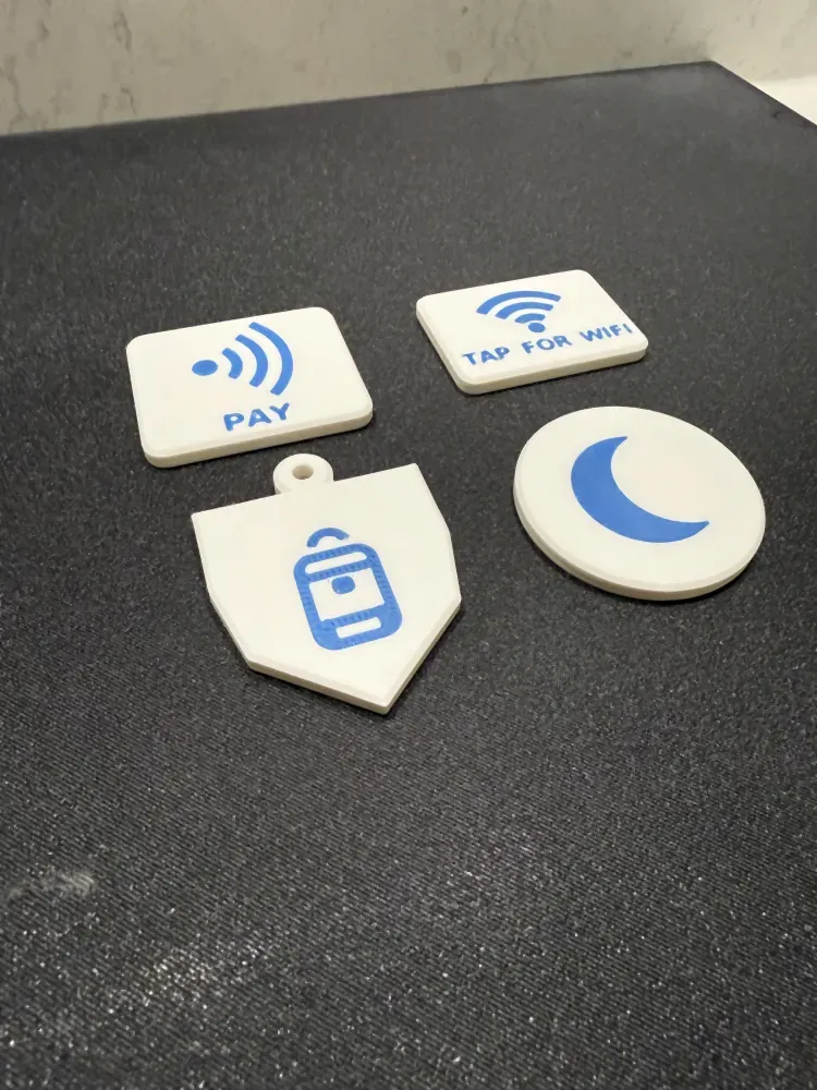 Set of 3D printed NFC tags with Wi-Fi, pay and other icons