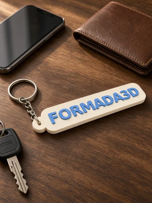 Formada3D keyring tag on a desk with keys, wallet and phone