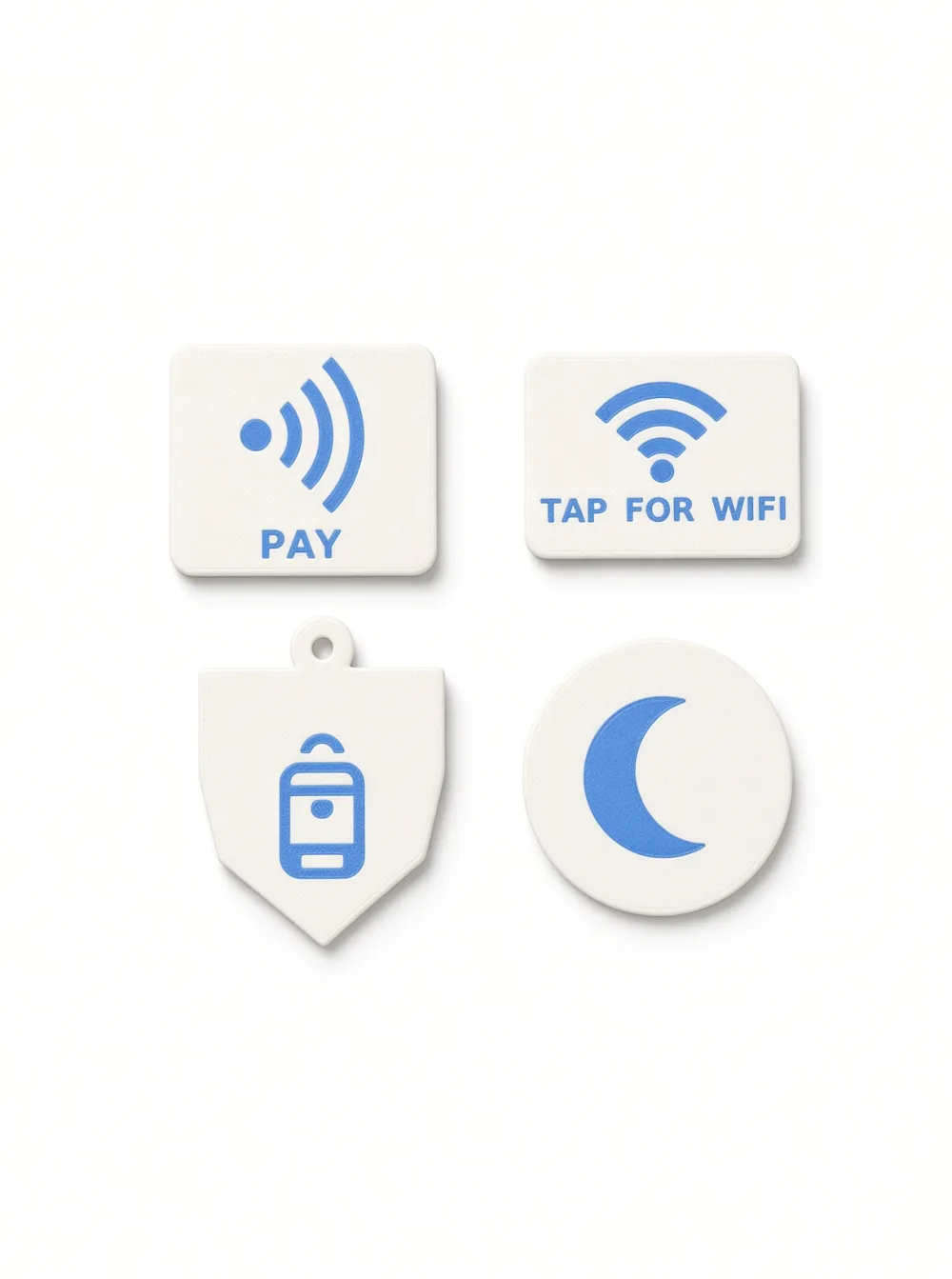 Four Formada3D NFC tags from the front: pay, Wi-Fi, sleep mode and kids bag keychain